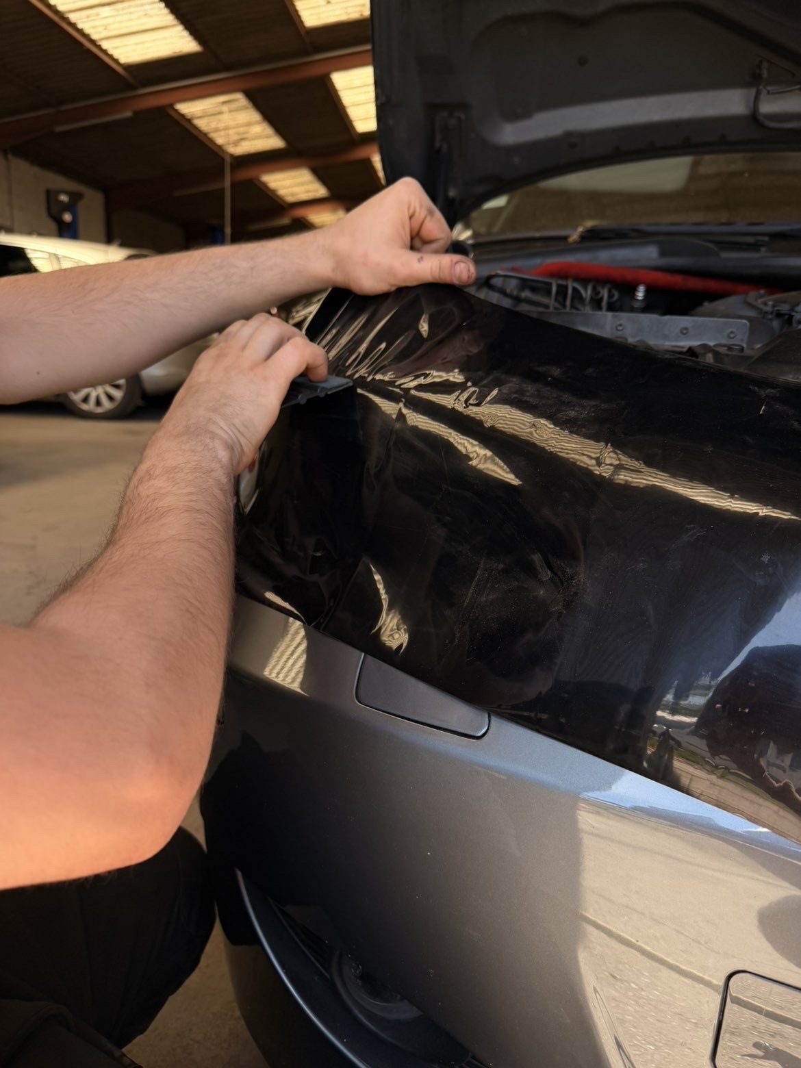 Phares arrière BMW teintés sombres — finition transparente CleanAutos Colmar